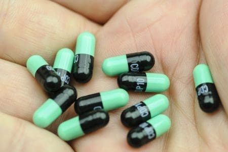 Can you overdose on Valium? A hand holding 10 Valium pills.